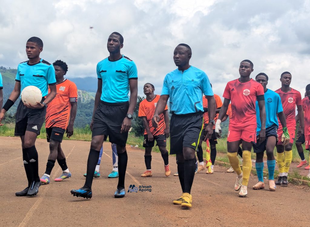 Match officials leading Options SA and Vision Sports into the pitch